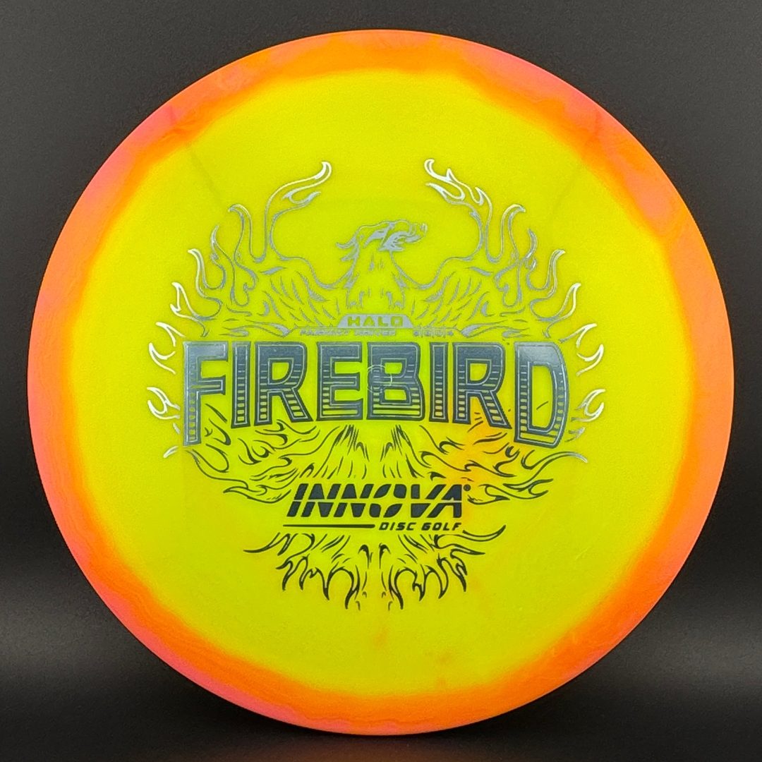 Neon yellow disc golf driver with orange outer ring and fiery dragon graphic