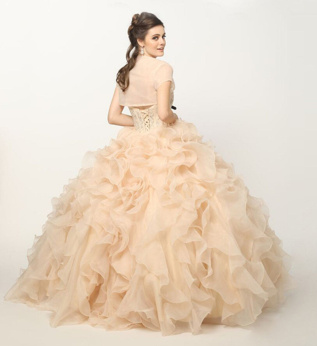 Champagne ball gown with strapless beaded corset and voluminous organza ruffle skirt, side view