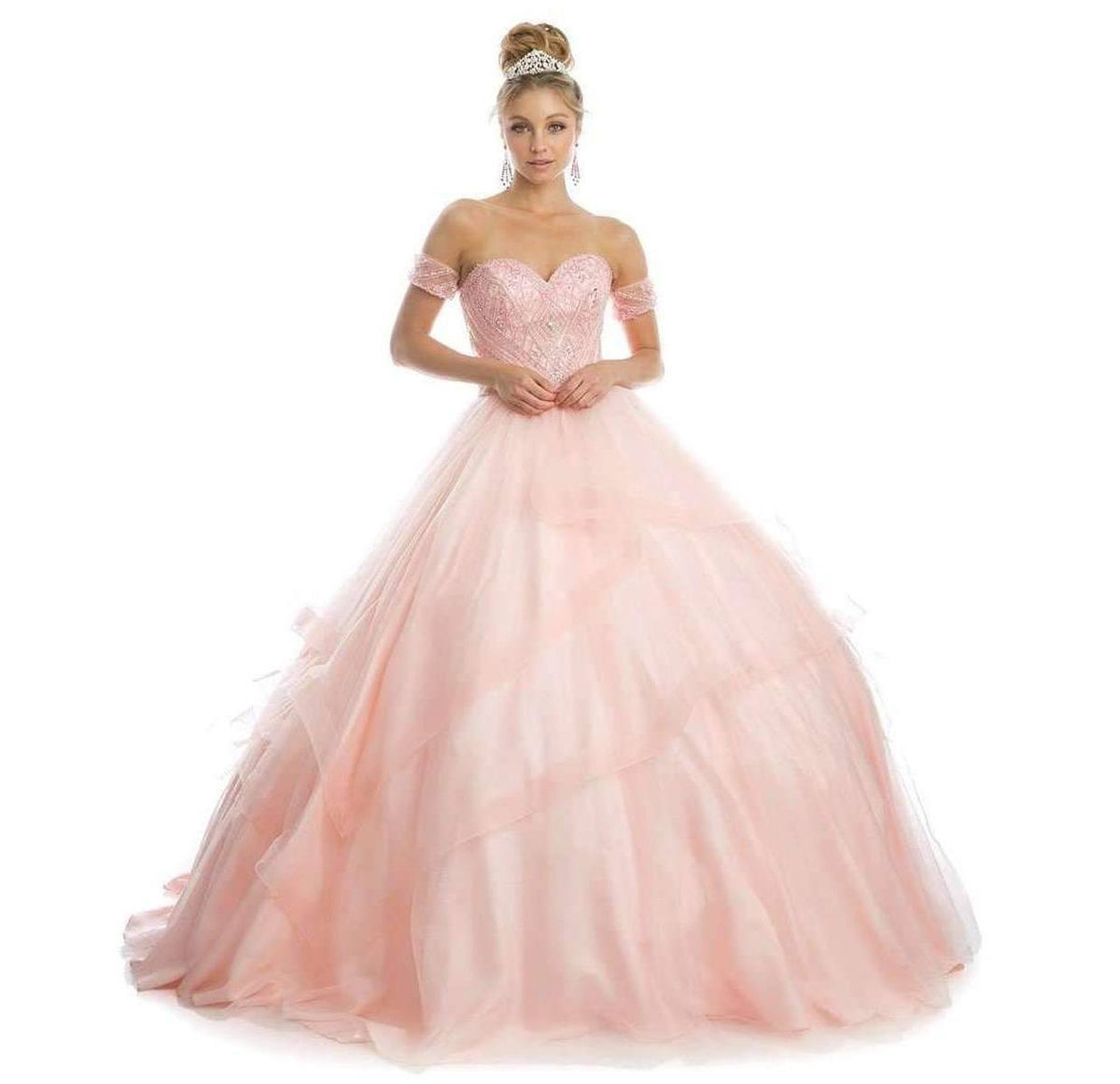 Blush tulle quinceanera ball gown with sparkly sweetheart bodice and voluminous skirt