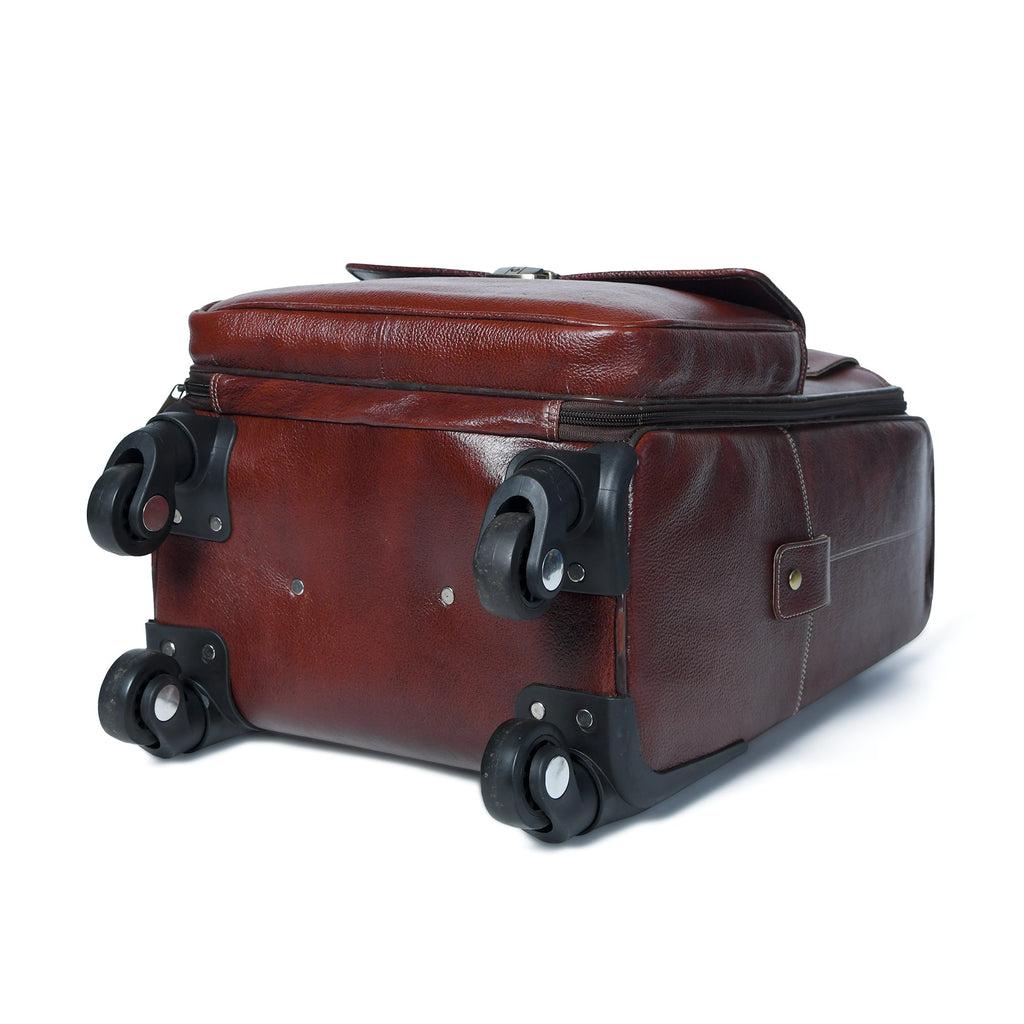 Brown leather carry-on trolley bag with telescoping handle and four wheels