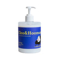 Dog shampoo and conditioner pump bottle with blue label and white dispenser