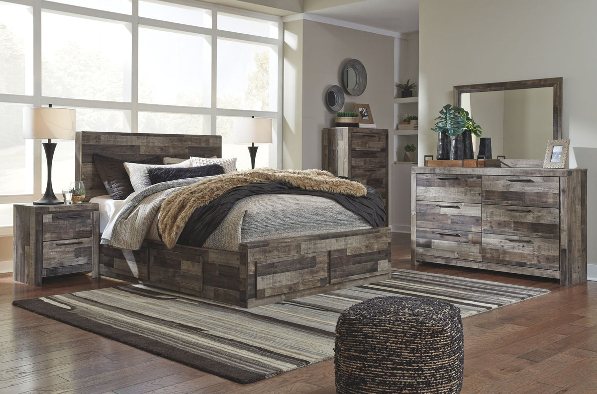 Youth bedroom set featuring gray wood-look bed with storage footboard, dresser, and mirror