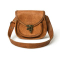 Tan leather crossbody sling bag with flap, bronze hardware, and adjustable strap