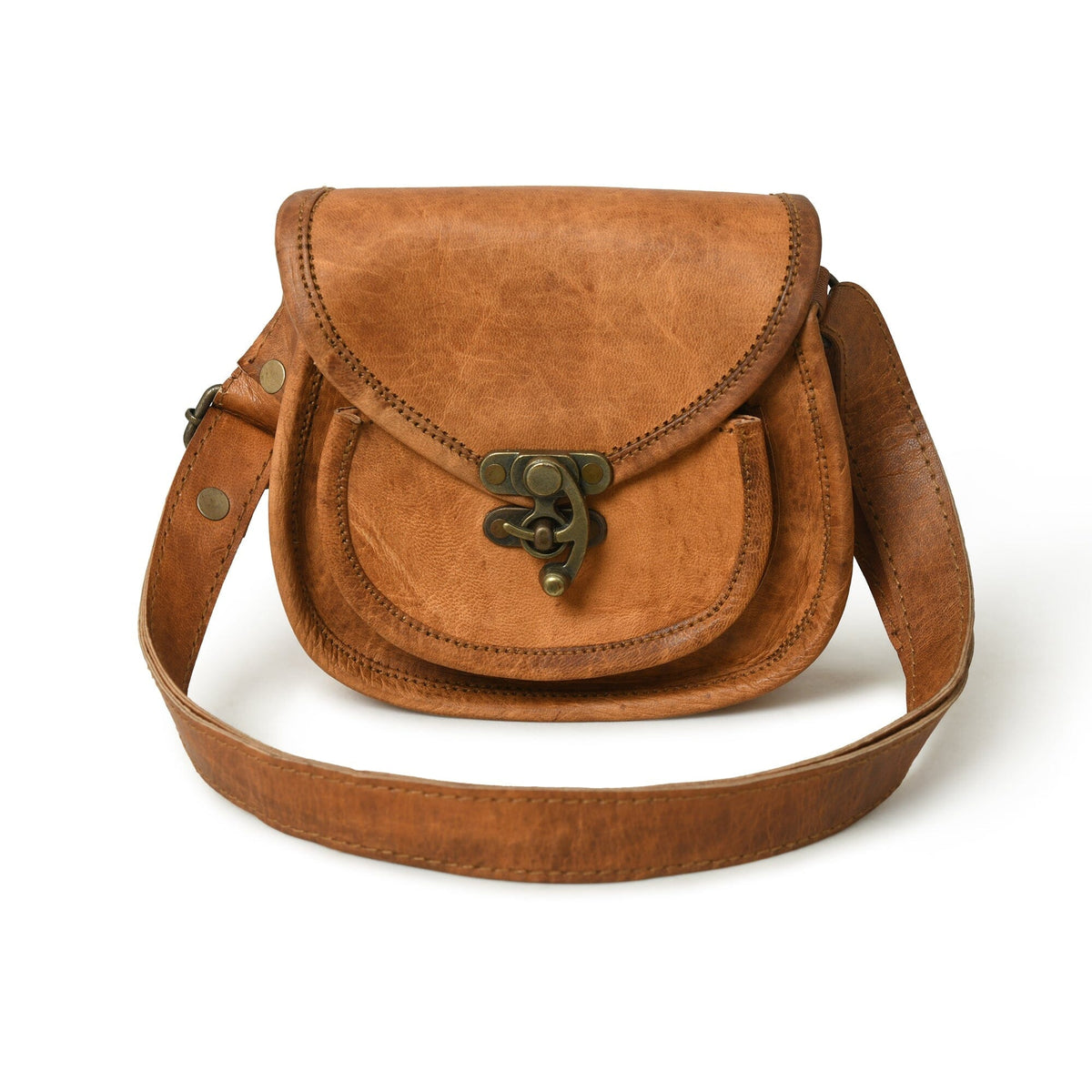 Tan leather crossbody sling bag with flap, bronze hardware, and adjustable strap