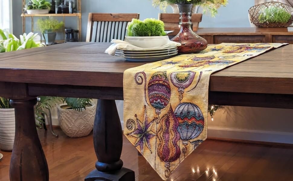 Bohemian tapestry table runner draped on dining table, featuring lantern and star artwork