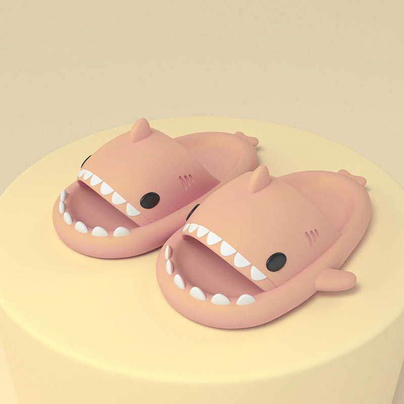 Pink shark-shaped slide sandals, open toe with molded fin and white tooth detail