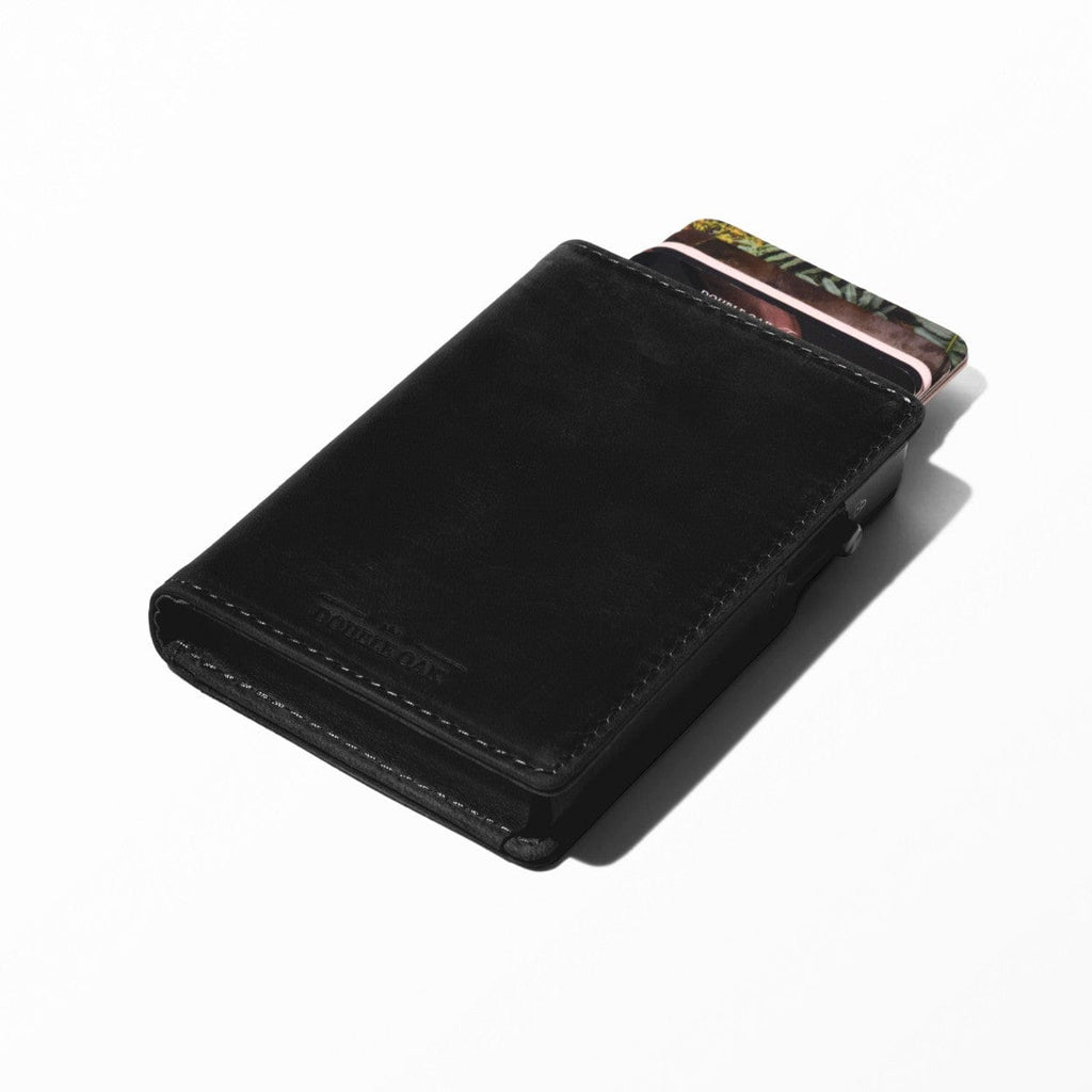 Black bifold leather wallet with card slots protruding and snap closure