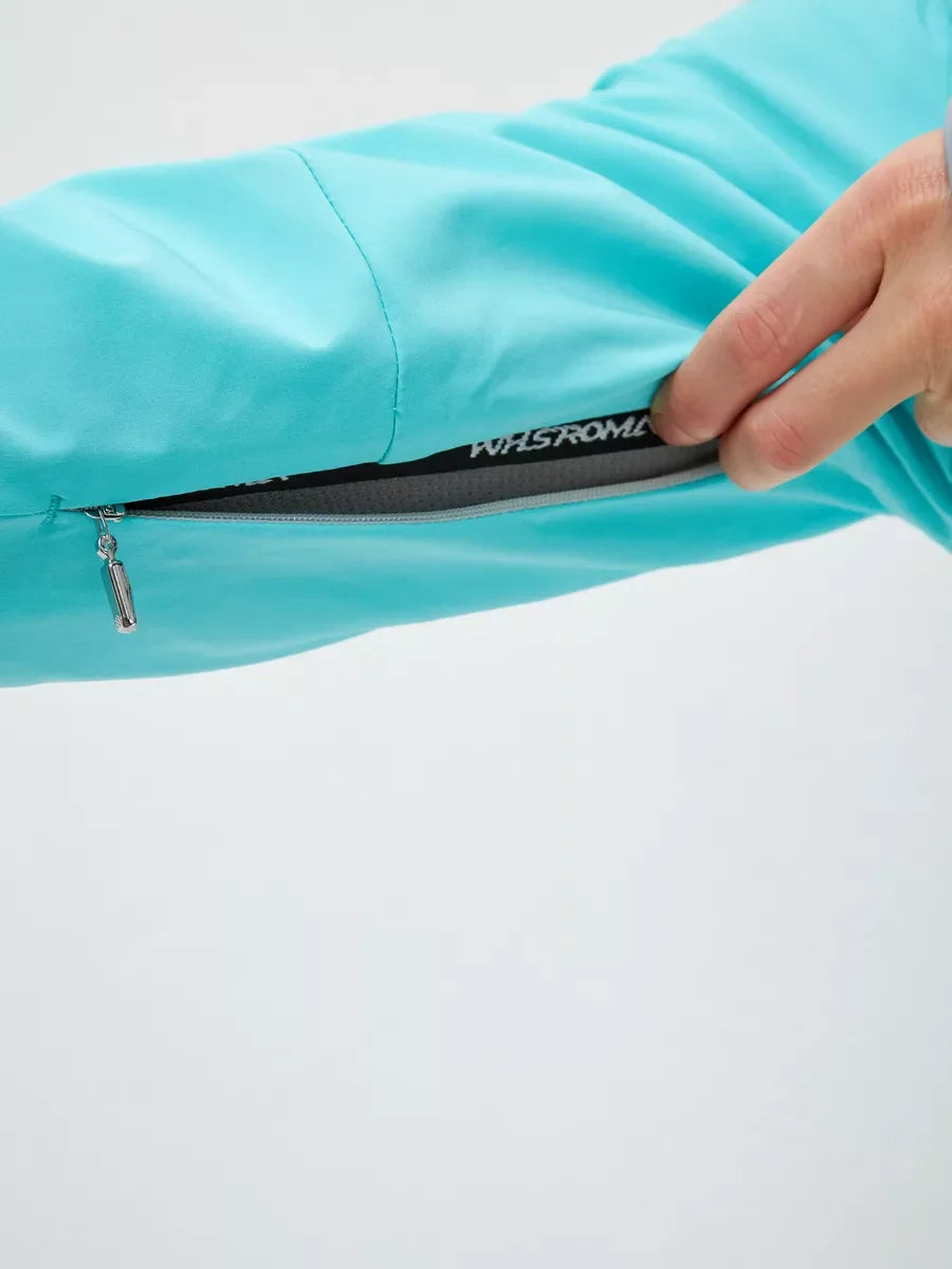 Mint sleeve with black interior lining and “WFSROM” logo label near zipper