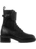 Black leather lace-up combat boot with side buckle strap and chunky lug sole