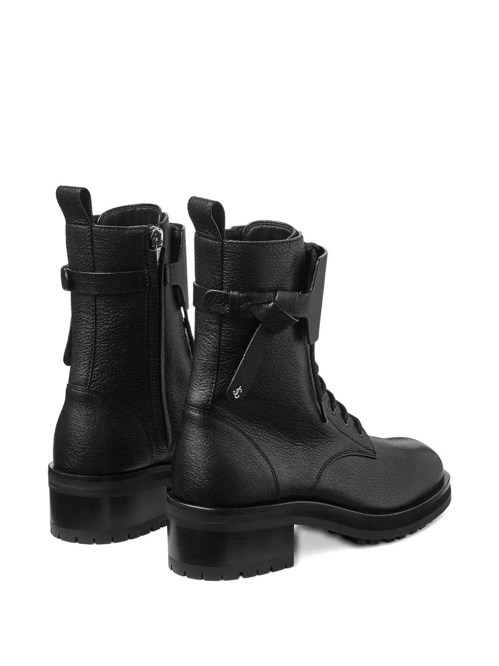 Black leather lace-up combat boots with front laces and thick treaded sole