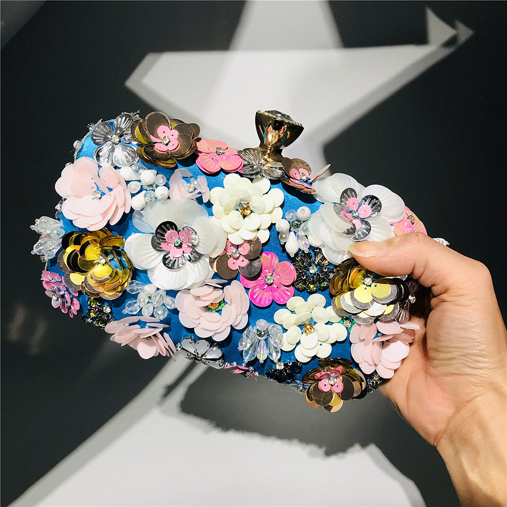 Floral sequin clutch bag with gold-tone chain strap and multicolor flower charms