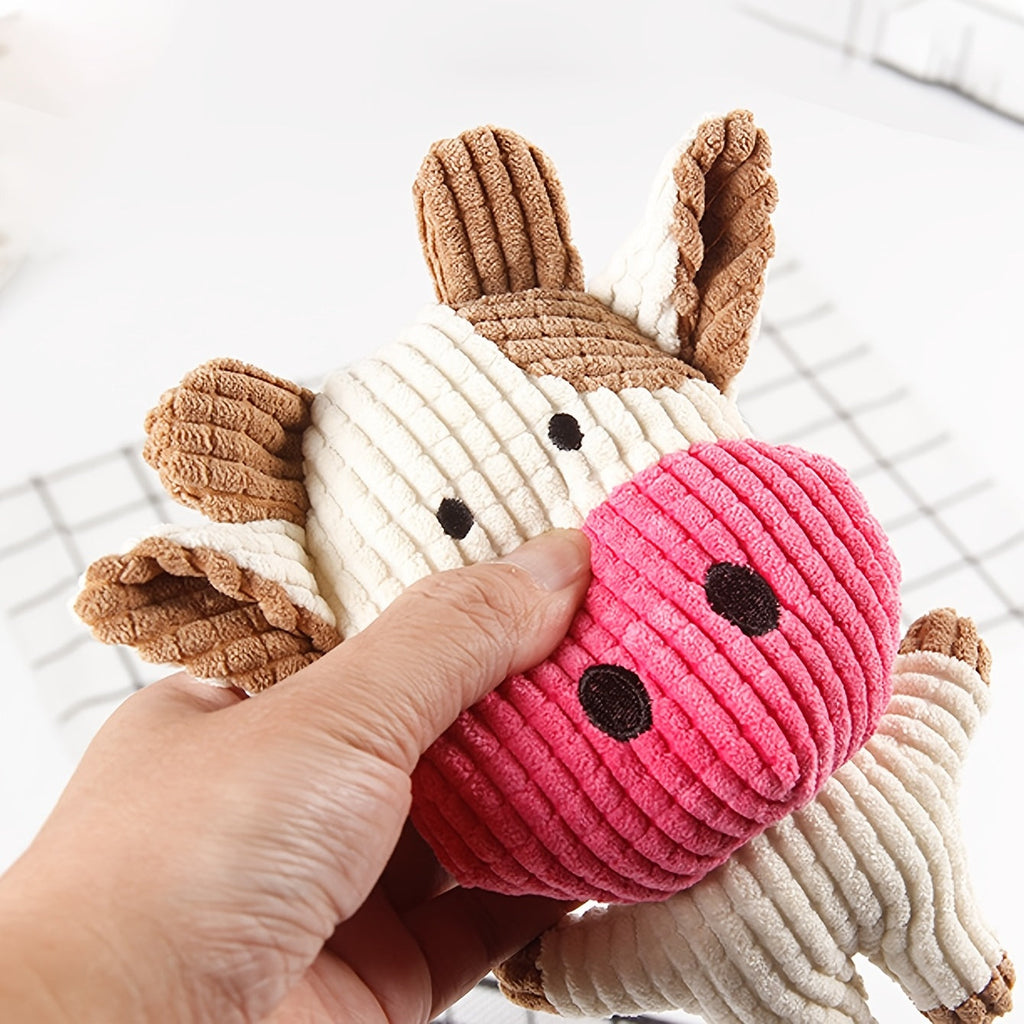 Pink-and-white cow-shaped plush dog toy with brown ears and hooves