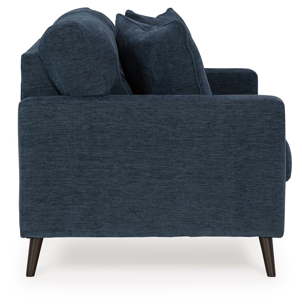 Navy fabric sofa with rounded arms, plush back cushions, and tapered wooden legs