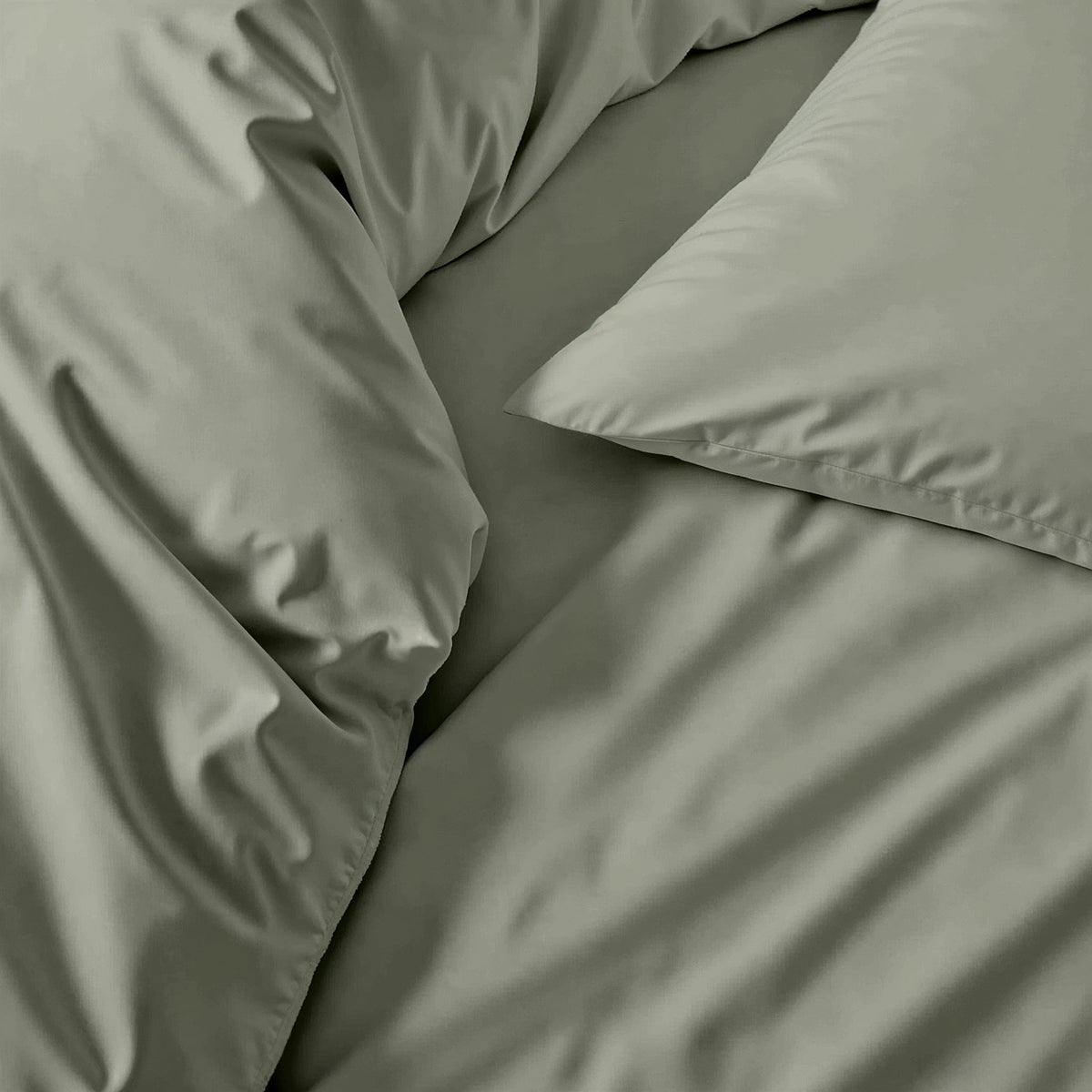 Australian sateen sheet set in sage green, close-up of fitted fabric texture