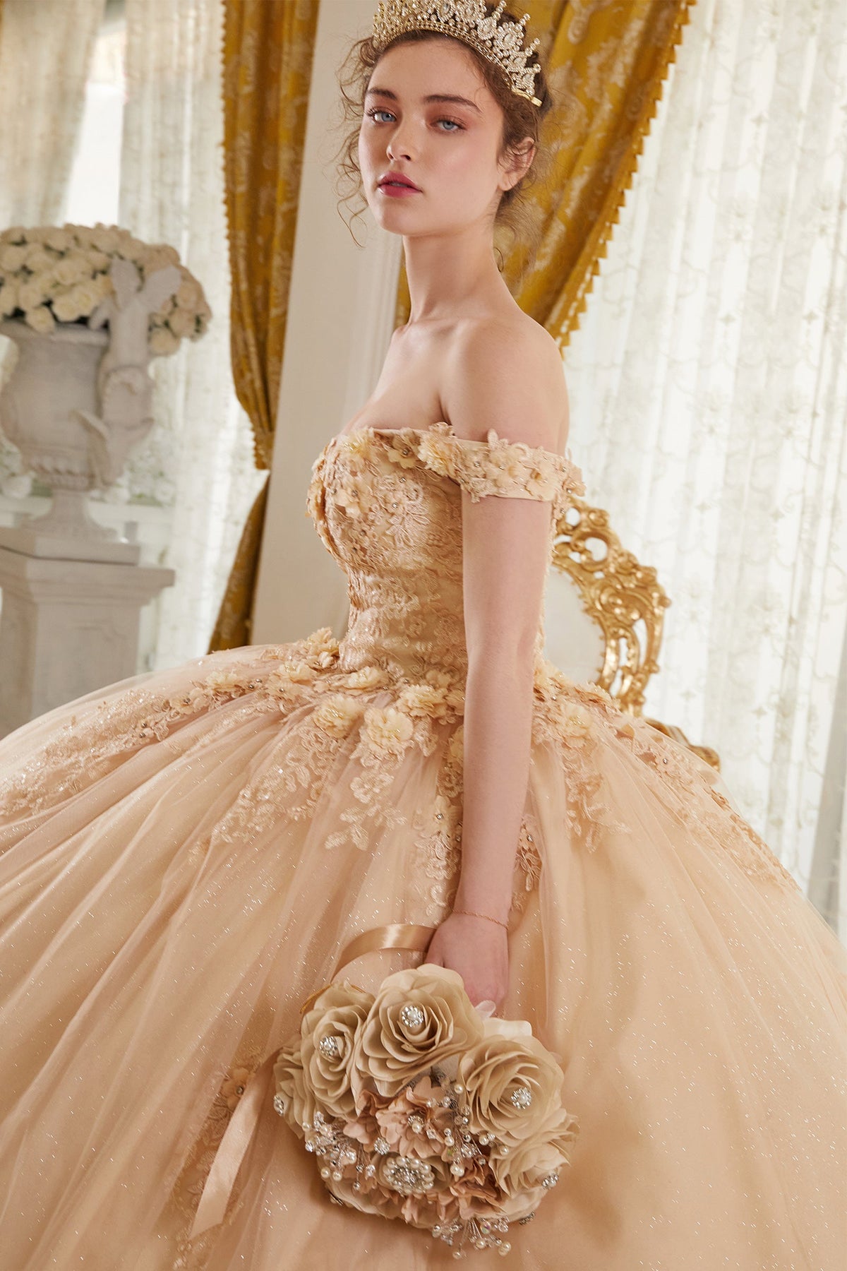 Champagne gold off-shoulder ball gown with lace sleeves and detailed floral skirt embellishment
