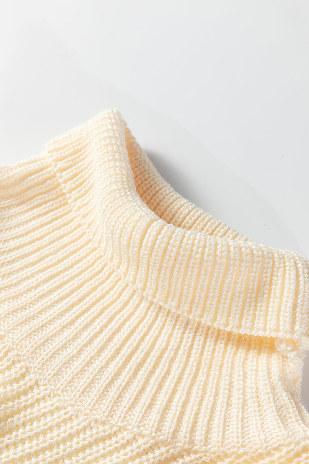 Cream ribbed turtleneck sweater knit detail with short-sleeve tunic shape