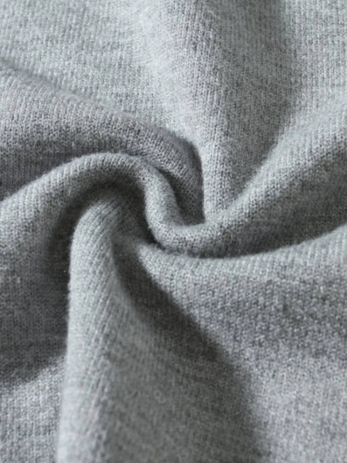 Men's plus size ribbed hem sweater fabric close-up with drape, heather gray