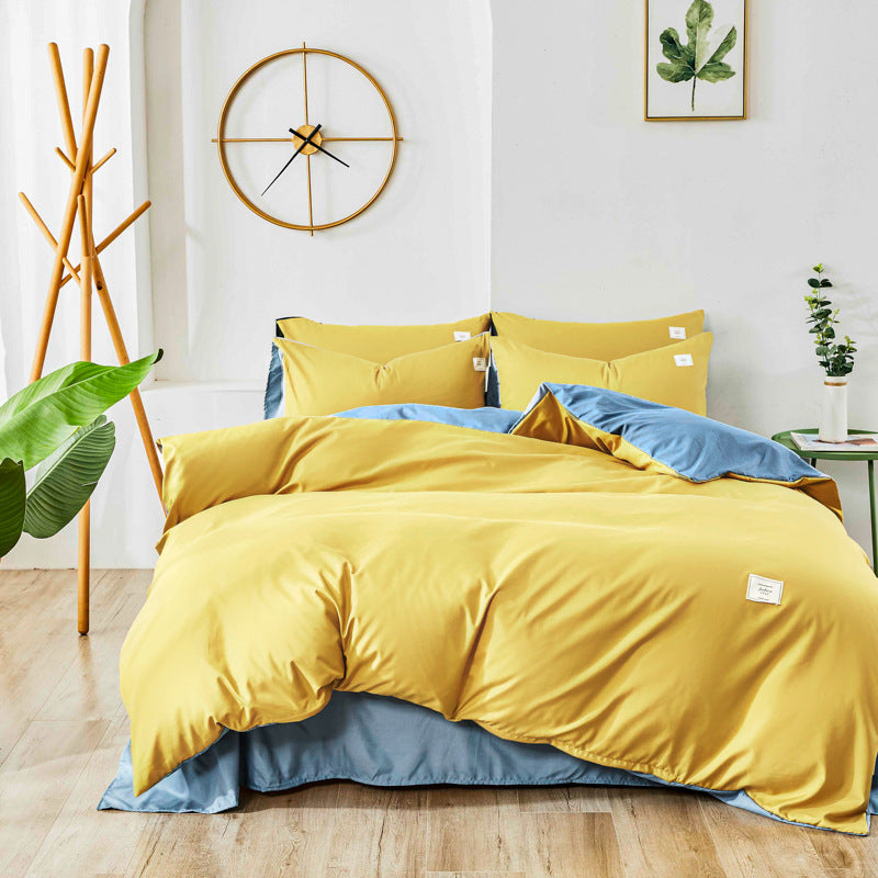 Yellow and light blue bedding set with matching pillowcases and duvet cover