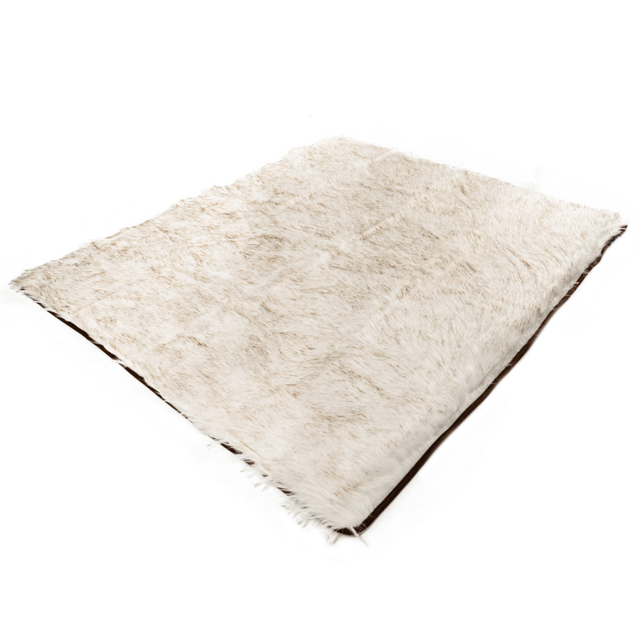 Waterproof faux-fur throw blanket folded, light beige with fringed corners