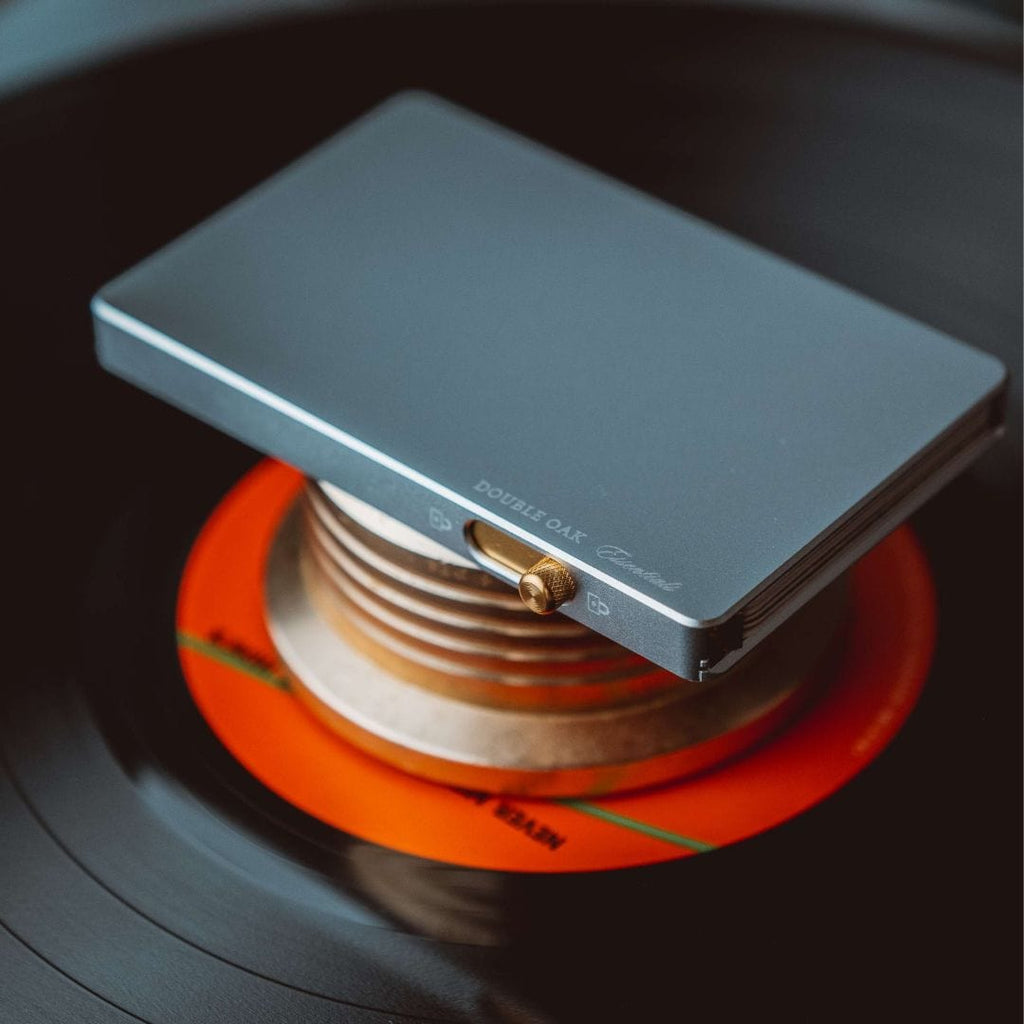 Blue-gray pop-up cardholder with brass button, slim wallet with card feed slot.