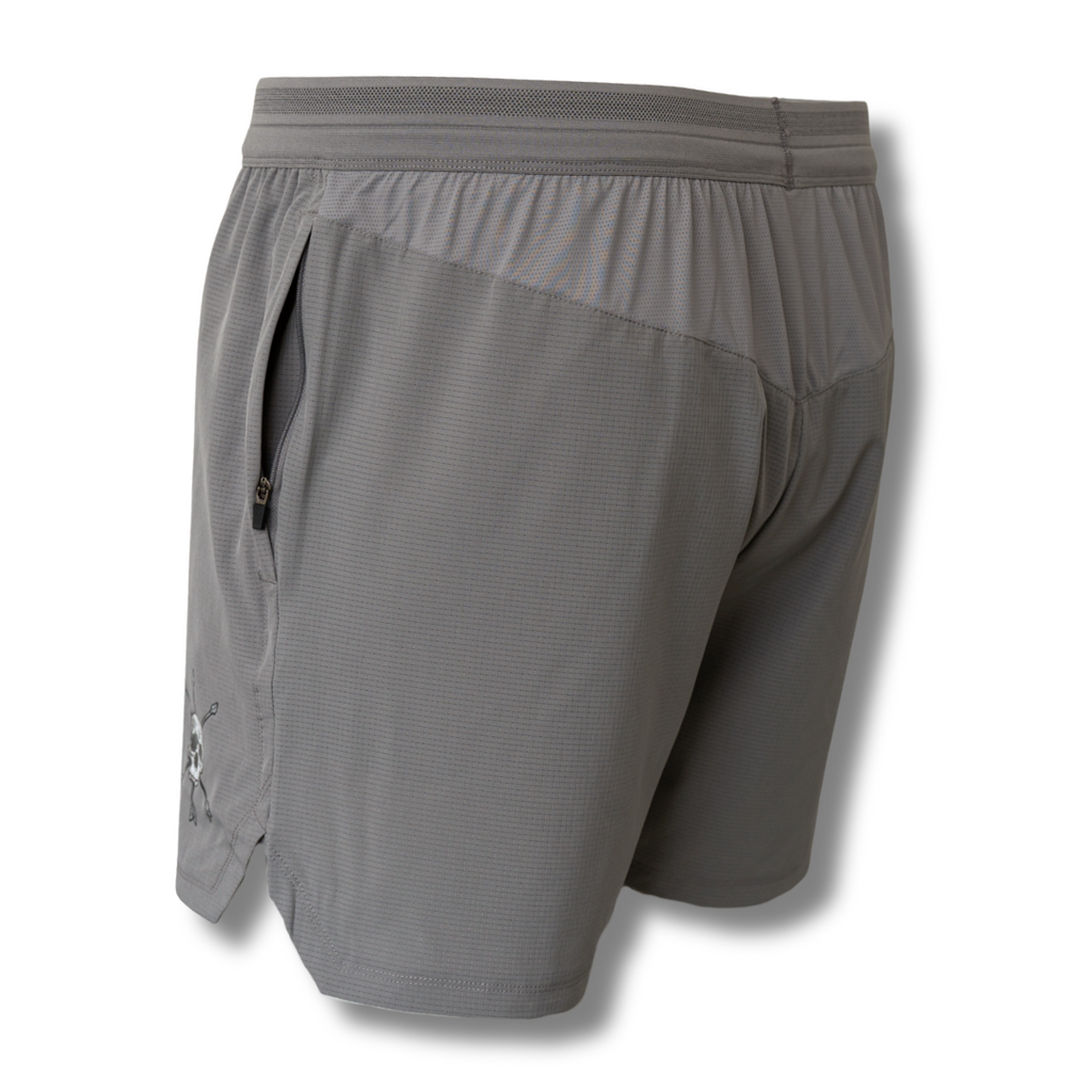 Gray athletic shorts back view with elastic waistband and small skull graphic on side.