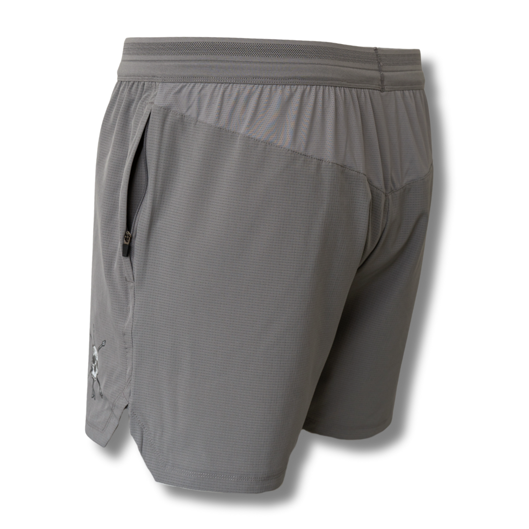 Gray athletic shorts back view with elastic waistband and small skull graphic on side.