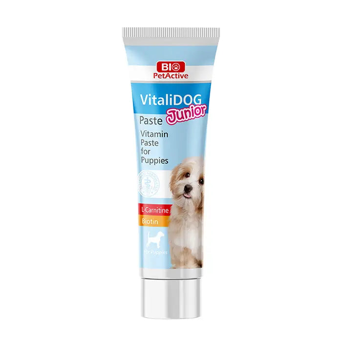 Puppy vitamin paste tube, light blue label and silver cap, vertical front view