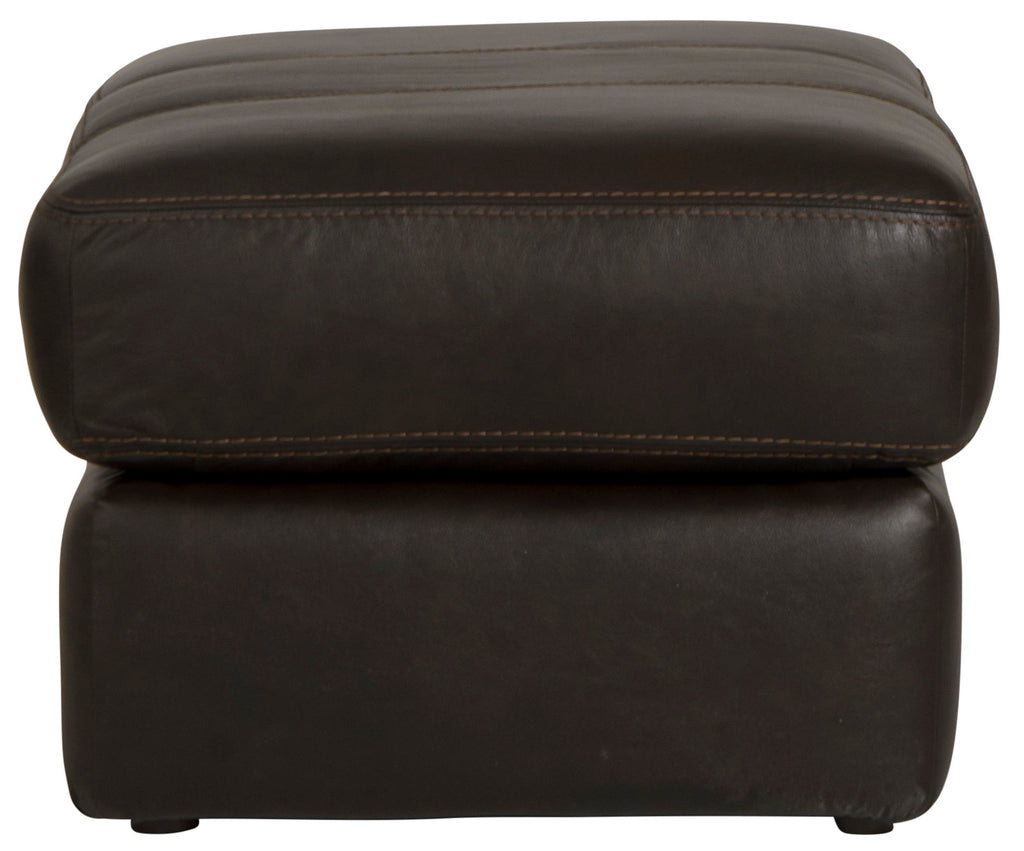 Chocolate leather ottoman close-up front with top edge seam and padded sides.