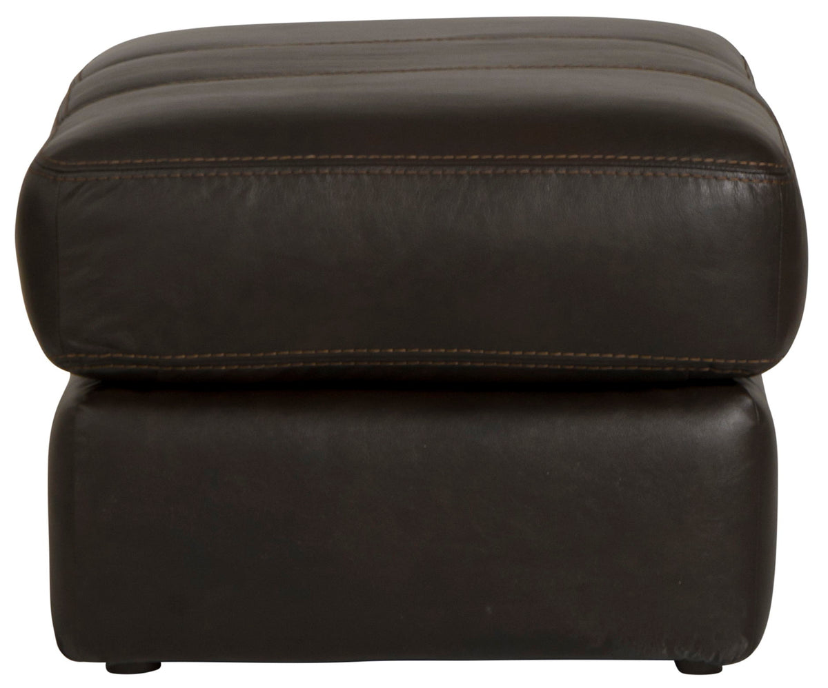 Chocolate leather ottoman close-up front with top edge seam and padded sides.