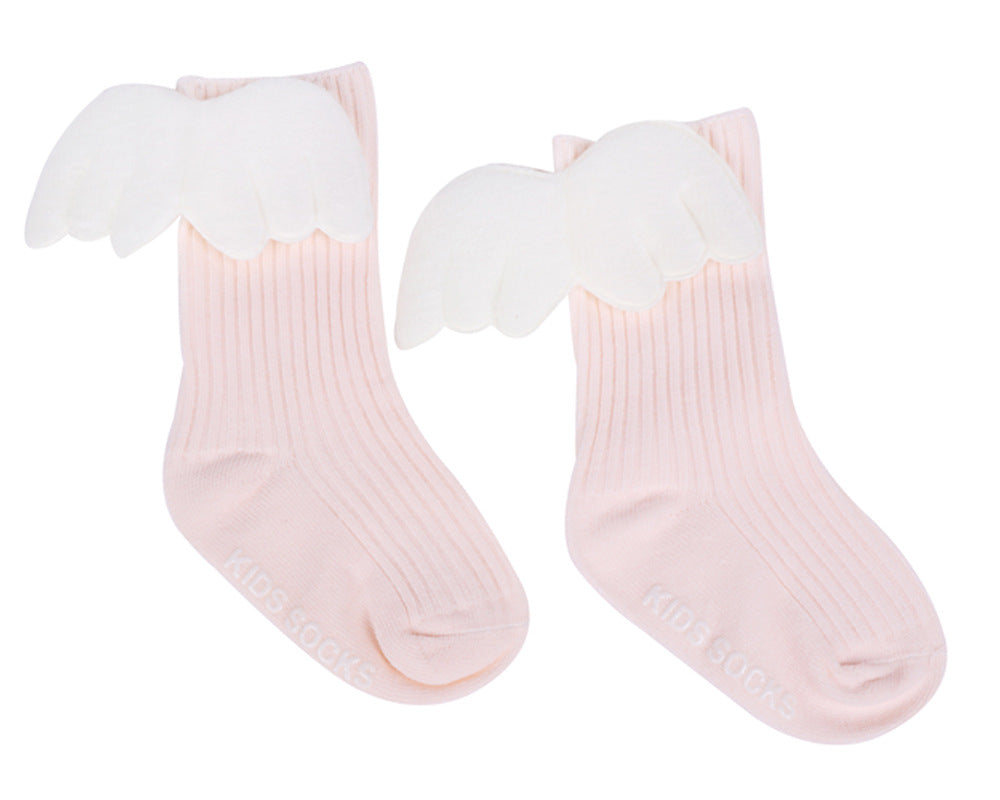 Light pink baby socks with white angel wing cuffs and ribbed knit, ankle length