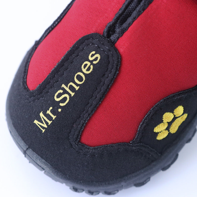 Red waterproof dog shoe with black sole, paw print detail, and 'Mr Shooes' patch