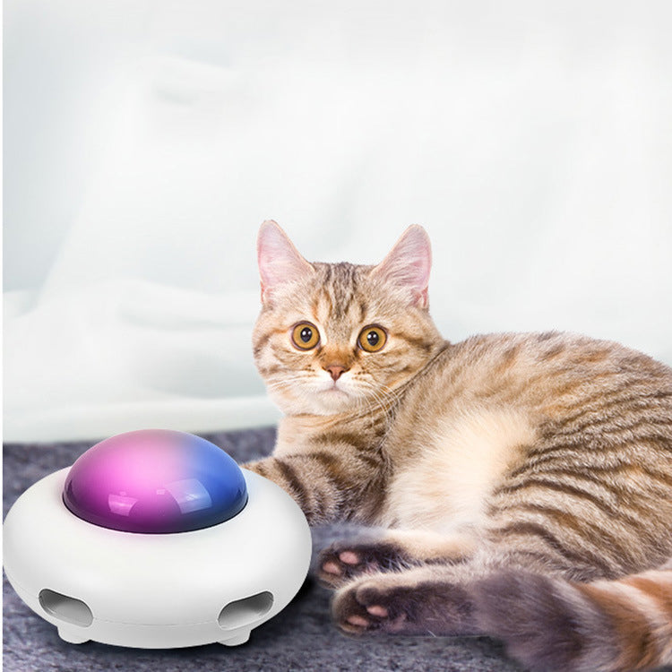 White electric cat toy UFO base with purple-tinted dome and feather attachment