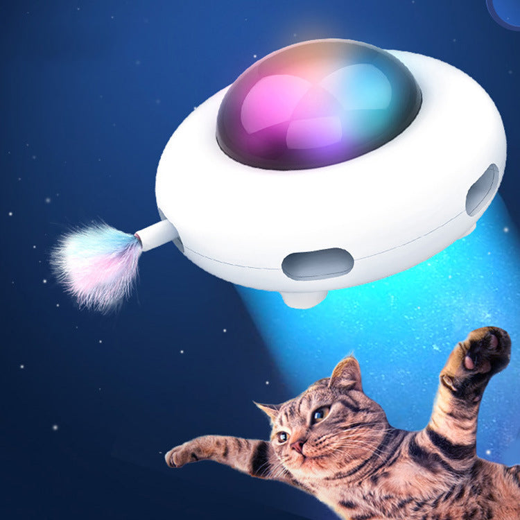 White UFO-style electric cat teaser with iridescent dome top and feather wand