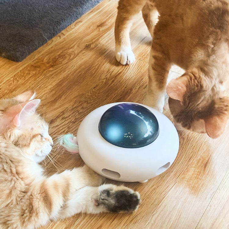White rotating pet toy with glowing dome and feather wand, for cats