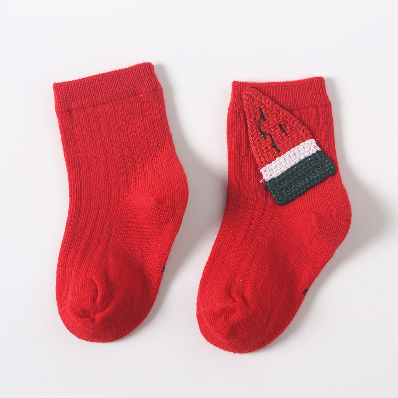 Pair of red baby socks with fishbone and dark stripe appliques on the instep