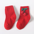 Pair of red baby socks with cherry applique and green stems on the instep