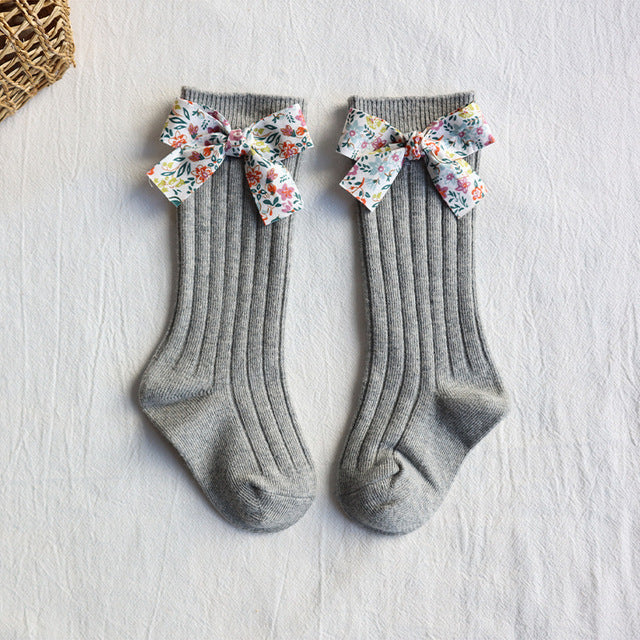 Baby long tube socks, grey ribbed knit with multicolor floral bow cuffs