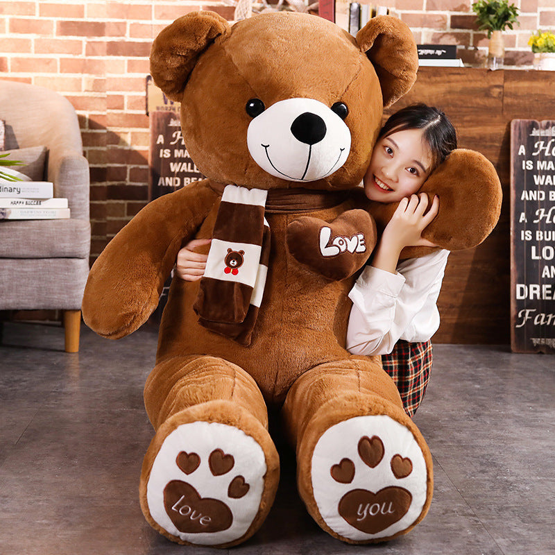 Brown plush teddy bear with heart “Love” bib and paw-shaped feet
