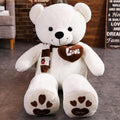 White plush teddy bear with heart “Love” patch and paw-print feet