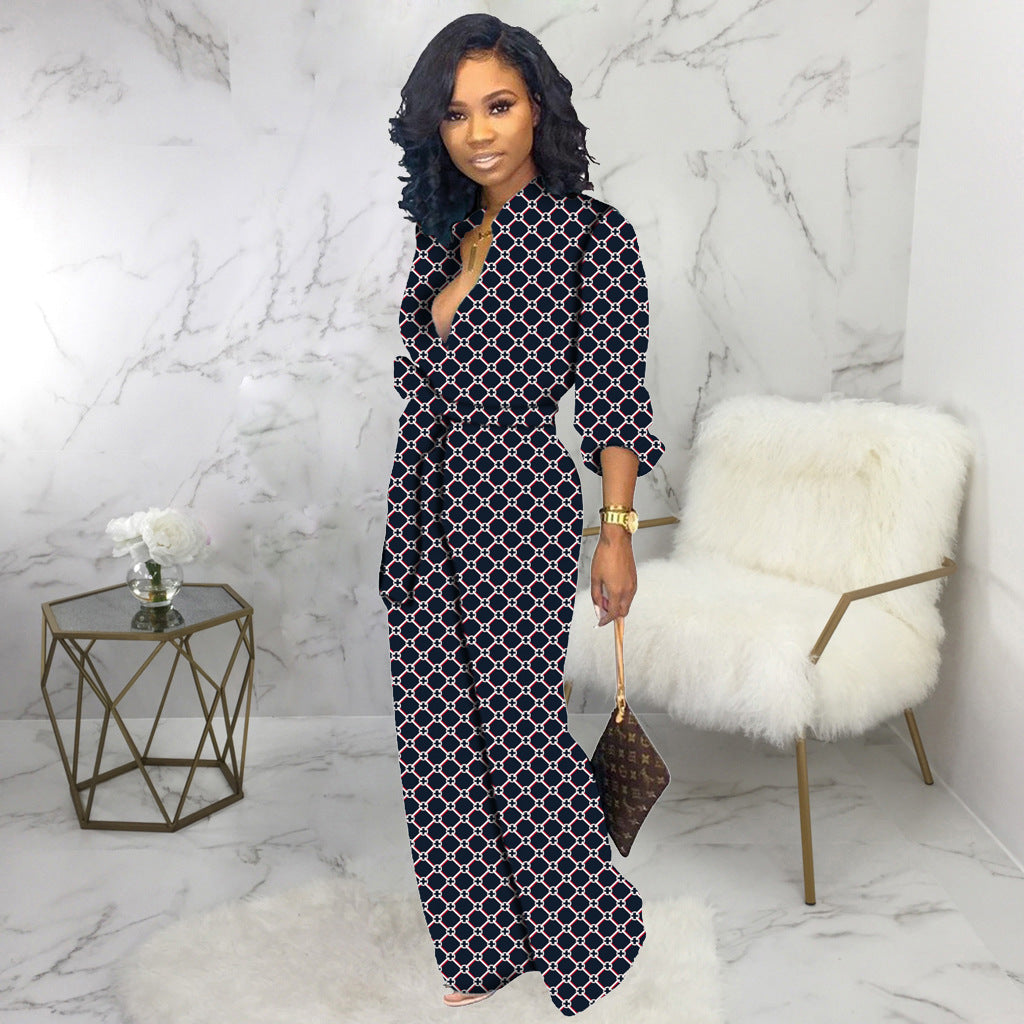 Women’s dark blue V-neck long-sleeve jumpsuit with linked geometric pattern and wide legs