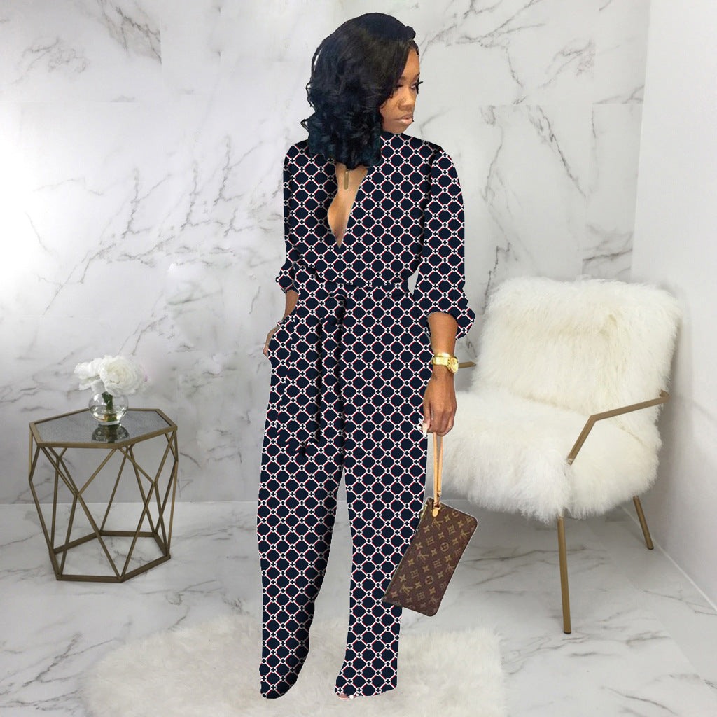 Women’s dark blue V-neck long-sleeve jumpsuit with linked geometric pattern, side view
