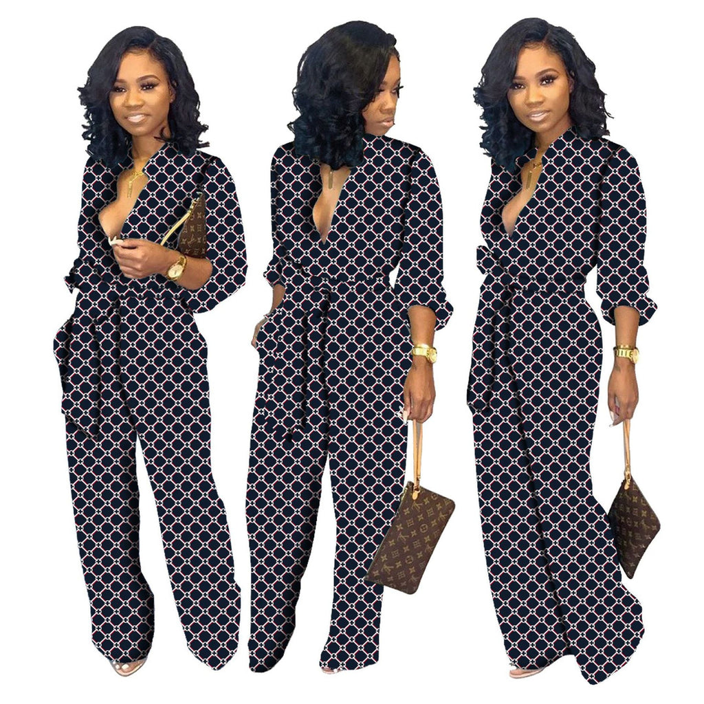 Women’s long-sleeve V-neck jumpsuit in dark blue with linked geometric pattern, wide legs