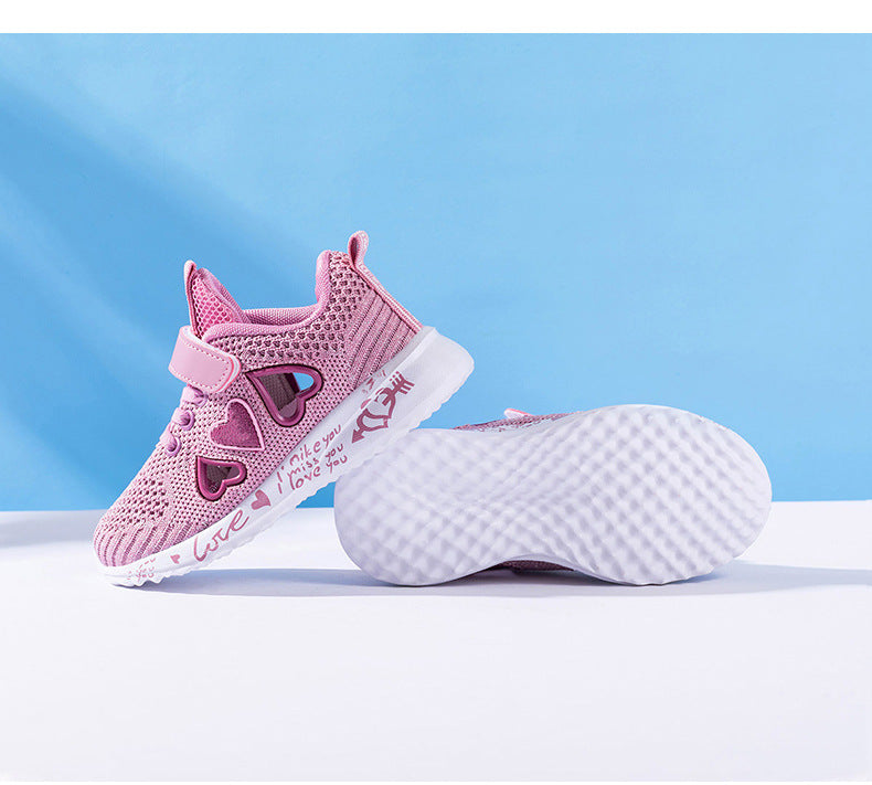 Kids pink mesh sneakers showing side profile and white grippy outsole