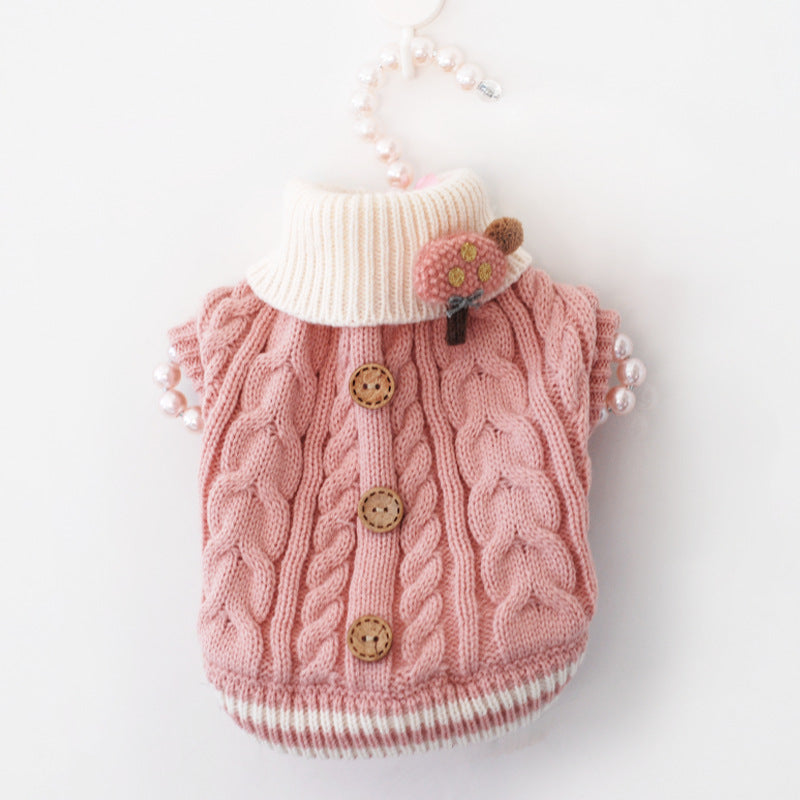 Pink knitted pet sweater with white turtleneck, brown buttons, cute flower bear applique