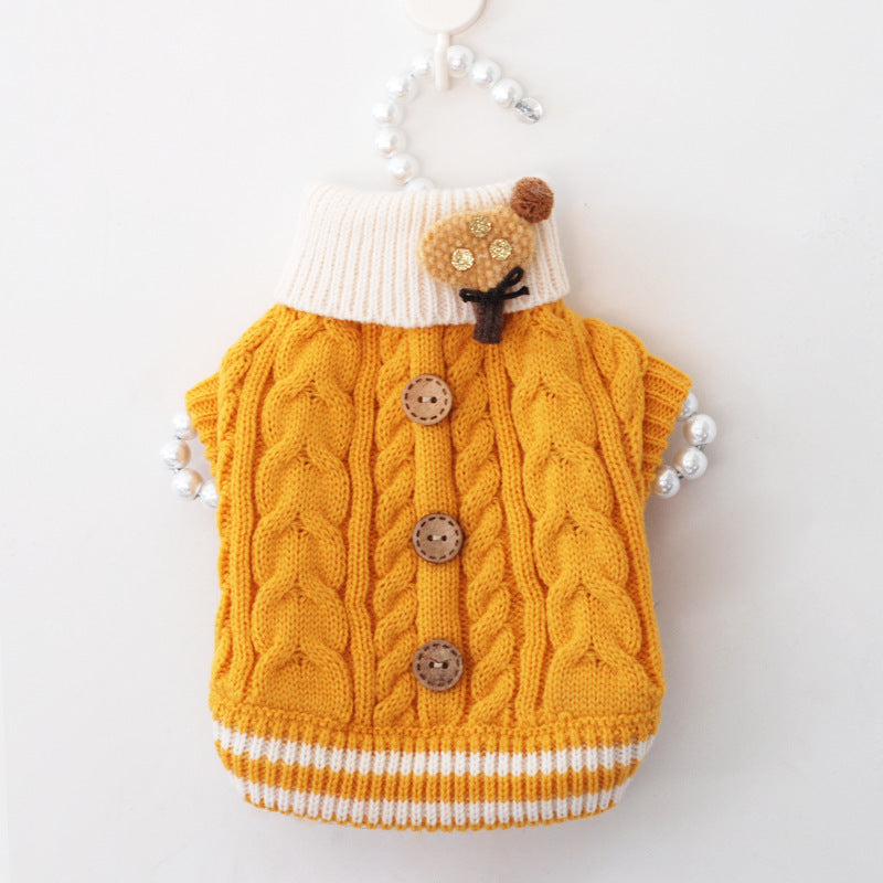 Yellow cable-knit pet sweater with white turtleneck, striped hem, brown button accents
