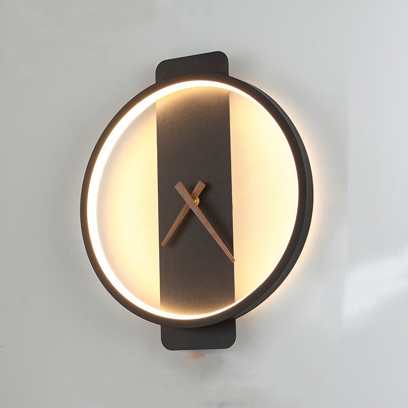 Black round clock wall lamp with warm LED ring and center clock hands