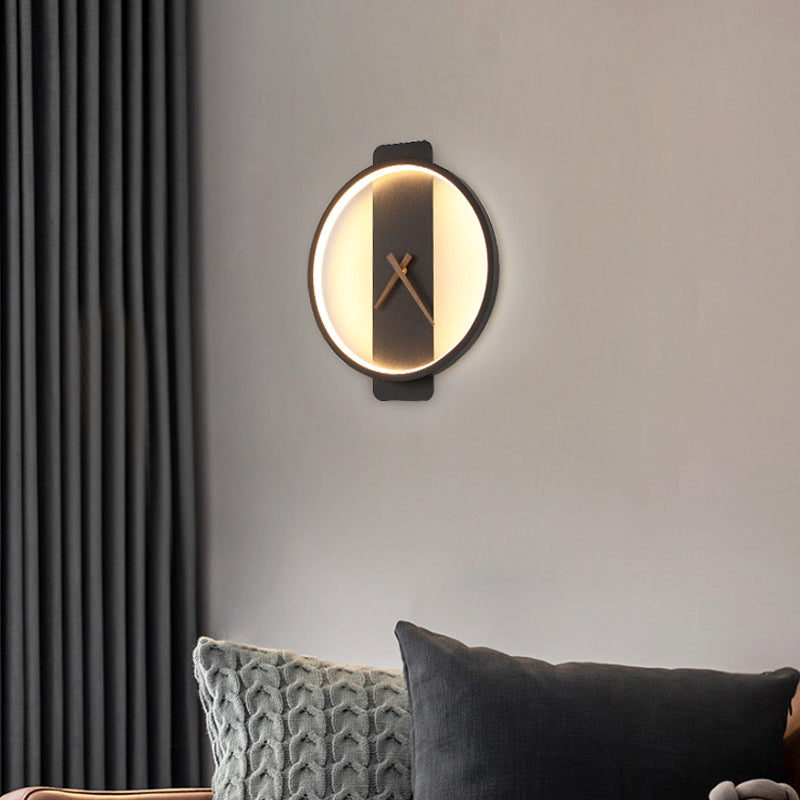 Gold round clock wall lamp with warm light ring and dark center panel