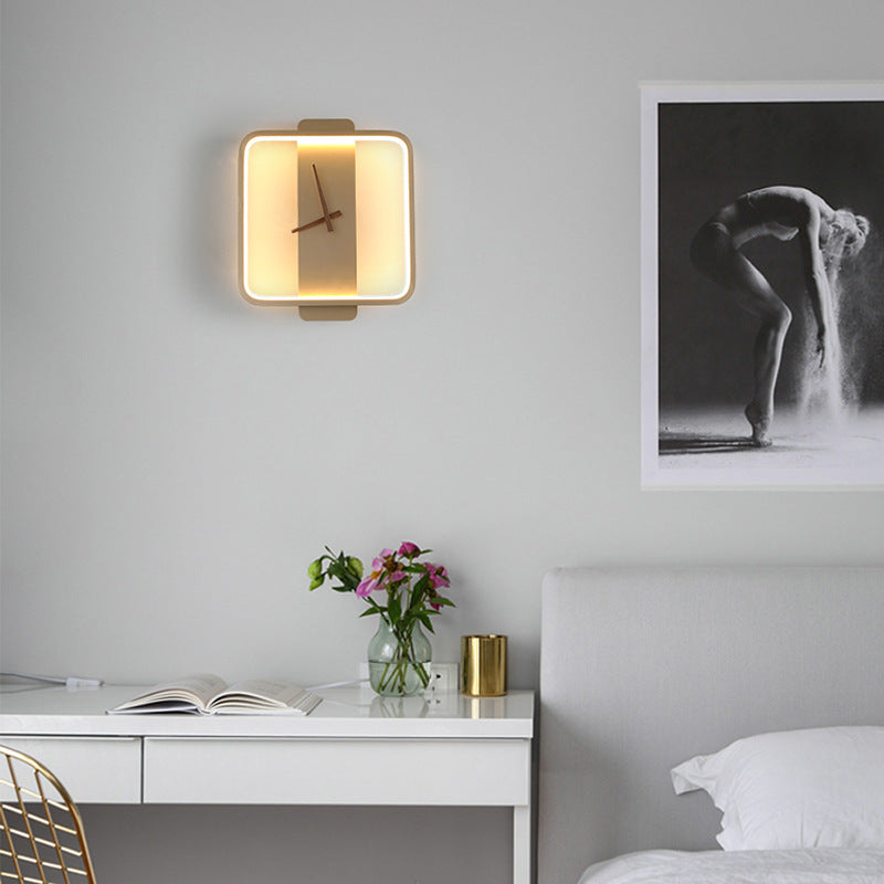 Gold square clock wall lamp with warm LED glow and visible clock hands