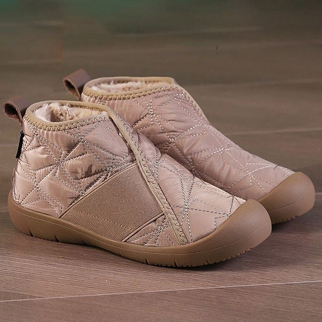 Beige quilted ankle snow boots with faux-fur lining, zip side, and flat rubber sole