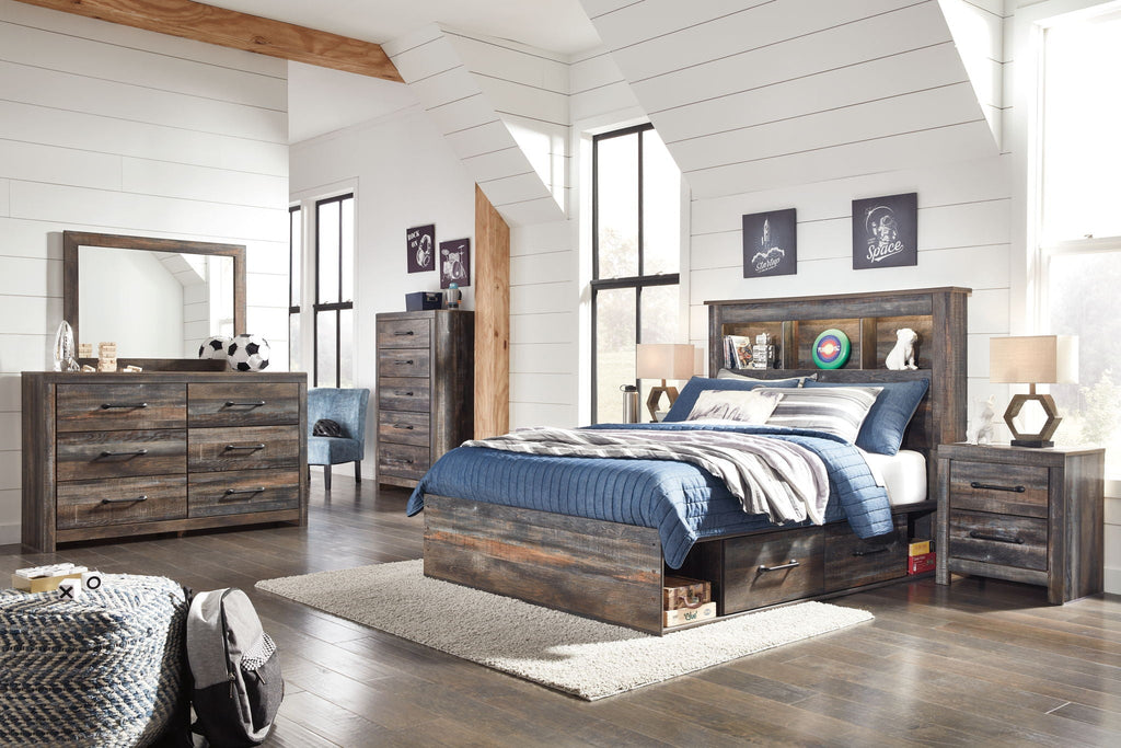 Dark wood storage bed with bookcase headboard and lower drawers, blue bedding